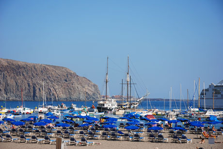 Blue umbrellas in the port photo