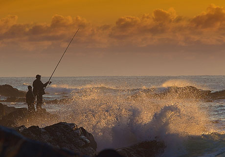 Ocean fishing from the rocks in Tenerife photo