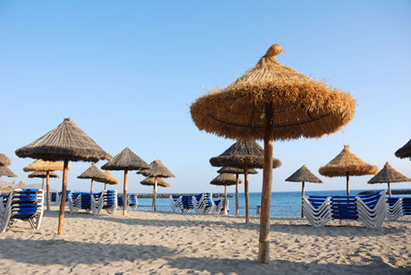 Umbrellas on the beach at Tenerife photo